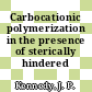 Carbocationic polymerization in the presence of sterically hindered bases.