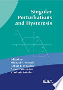 Singular perturbations and hysteresis /
